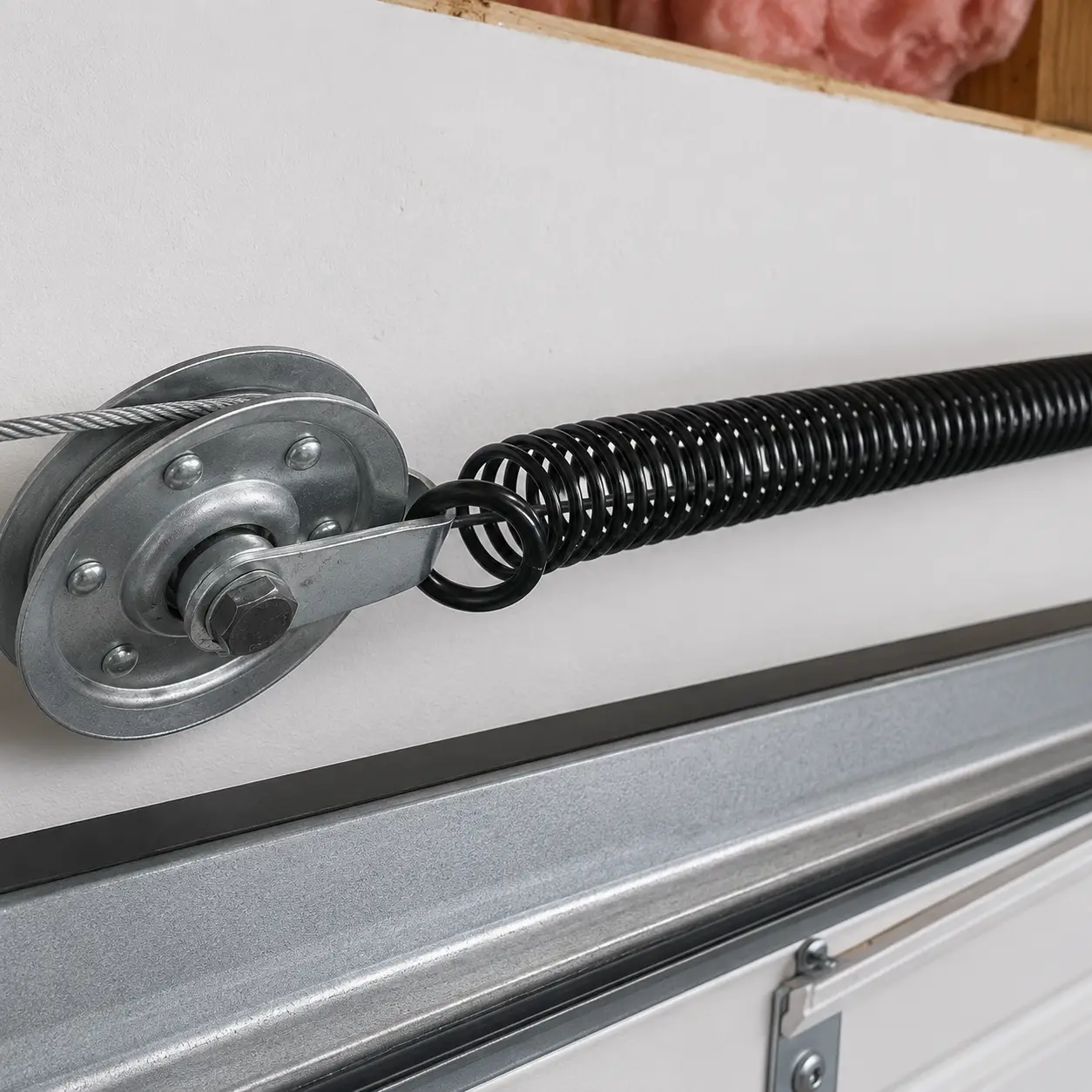 Extension spring replacement for a garage door